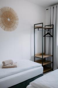 a room with two beds and a mirror on the wall at Apartment am Berg in Grünstadt