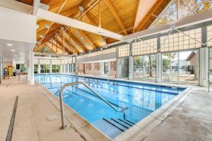 a large indoor swimming pool with a large swimming pool at Bear Trap Dunes - 214H October Glory Ave in Ocean View