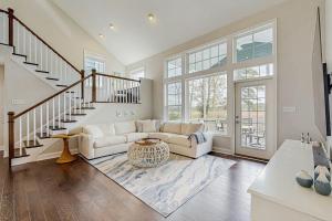 a living room with a couch and a staircase at Marlin Chase --- 30347 Bermuda Dr in Ocean View