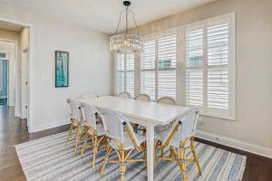 a dining room with a white table and chairs at Marlin Chase --- 30347 Bermuda Dr in Ocean View