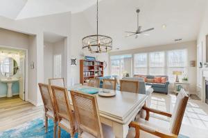 a dining room and living room with a table and chairs at Bear Trap Dunes - 81 Tulip Poplar in Ocean View