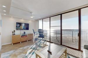 a living room with a view of the ocean at Sea Colony - 702 Dover House Rd. in Bethany Beach