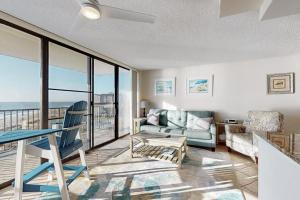 a living room with a couch and a table at Sea Colony - 702 Dover House Rd. in Bethany Beach