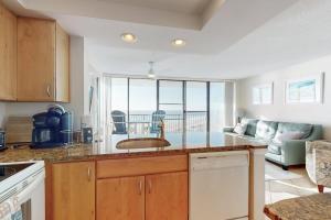 a kitchen with a counter with a view of the ocean at Sea Colony - 702 Dover House Rd. in Bethany Beach +34 photos