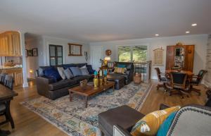 a living room with couches and a table at Eagles Nest on Seven Devils in Seven Devils +39 photos