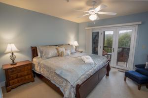 a bedroom with a bed and a ceiling fan at Havens Rest in Valle Crucis