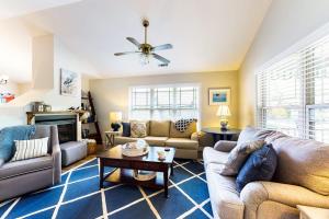 a living room with couches and a tv at Forest Reach --- 33720 Chatham Way in Frankford