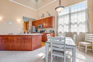 a kitchen with a table and chairs and a counter top at Bear Trap Dunes - 28 October Glory in Ocean View +35 photos