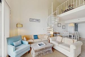 a living room with a couch and two chairs at Sea Colony - 902 Georgetowne House in Bethany Beach