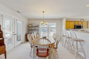 a kitchen and dining room with a table and chairs at Sea Colony - 55006 Pine View Rd in Bethany Beach