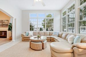a large living room with a couch and a table at Bear Trap Dunes - 96 Willow Oak in Ocean View