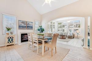 a living room with a table and chairs and a fireplace at Bear Trap Dunes - 96 Willow Oak in Ocean View +56 photos