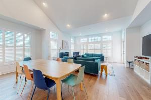 a living room with a table and chairs and a couch at Marlin Chase---30453 Madeira Ln in Ocean View