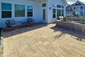 a patio with chairs and a table on a house at Marlin Chase---30453 Madeira Ln in Ocean View