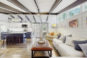 a living room with a couch and a table at Middlesex Beach - 9 Bridge in Bethany Beach