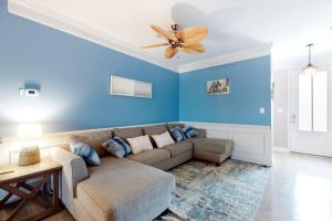 a living room with a couch and a ceiling fan at Bishops Landing -- 16985 Bellevue in Millville +22 photos