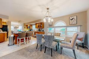 a kitchen and dining room with a dining table and chairs at Salt Pond --- 494 Bethany Loop in Bethany Beach +59 photos