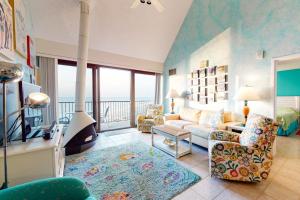 a living room with a couch and a fireplace at Sea Colony - 904 Dover House Rd in Bethany Beach