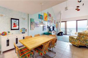 a dining room with a wooden table and a couch at Sea Colony - 904 Dover House Rd in Bethany Beach +37 photos