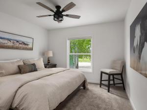 a bedroom with a bed and a ceiling fan at Mountain View Home on 2 Acres in Bozeman
