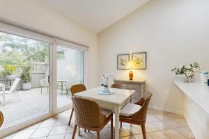 a kitchen and dining room with a table and chairs at Sea Colony - 7903 Timberlake in Bethany Beach