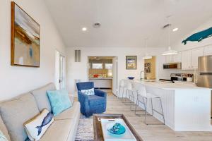 a living room with a couch and a kitchen at Sea Colony West Pine in Bethany Beach