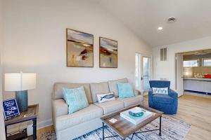 a living room with a couch and a table at Sea Colony West Pine in Bethany Beach