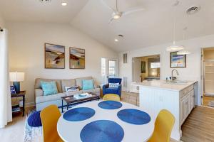 a kitchen and living room with a table and chairs at Sea Colony West Pine in Bethany Beach