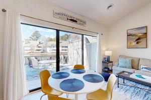 a living room with a table and chairs at Sea Colony West Pine in Bethany Beach +41 photos