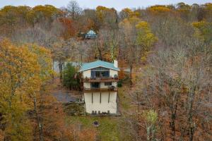 an aerial view of a house in the middle of a forest at Heavens Door in Beech Mountain