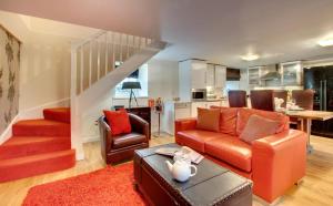 a living room with a couch and a table at 2 Bed in Belford oc-gd1023 in Warenford +4 photos