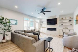 a living room with a couch and a ceiling fan at The Peninsula --- 33129 Serenity Circle #87 in Millsboro