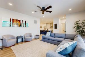 a living room with a couch and a ceiling fan at The Peninsula --- 33129 Serenity Circle #87 in Millsboro