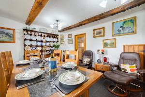 a dining room with a table and chairs at 3 Bed in Llanidloes oc-waa246 in Llangurig