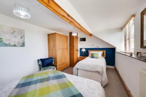 a bedroom with two beds in a room at 3 Bed in Llanidloes oc-waa246 in Llangurig