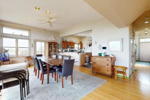 a kitchen and dining room with a table and chairs at Seatowne - 36912 Bayside in Fenwick Island
