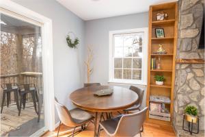 a dining room with a table and chairs at Whiskey Ridge in Boone