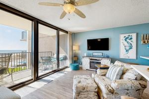 a living room with a couch and a flat screen tv at Sea Colony --- 508 Dover House Rd in Bethany Beach
