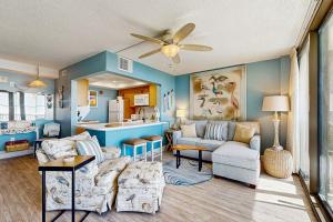 a living room with a couch and a kitchen at Sea Colony --- 508 Dover House Rd in Bethany Beach