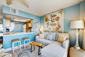 a living room with a couch and a kitchen at Sea Colony --- 508 Dover House Rd in Bethany Beach