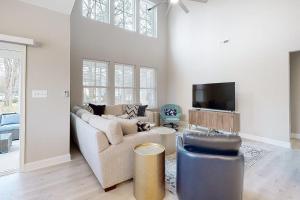 a living room with a couch and a tv at Bishops Landing --- 38480 Carroll Dr in Millville