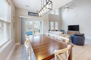 a dining room with a large wooden table and chairs at Bishops Landing --- 38480 Carroll Dr in Millville