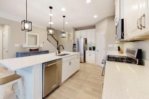 a kitchen with white cabinets and a counter top at Bishops Landing --- 38480 Carroll Dr in Millville