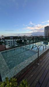 a swimming pool on the roof of a building at Laguna beach house in Cabedelo +11 photos