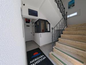 a staircase in a house with a stair mat at Merhaba Pansiyon in Bodrum City