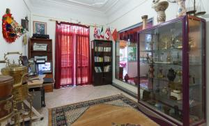 a room with a large glass display case at Riad Asma in Taroudant