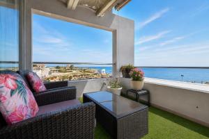 a living room with a view of the ocean at Calatabarca B&B in Tabarca