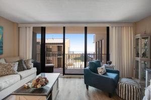 a living room with a couch and a table at Sea Colony --- 208 Brandywine House in Bethany Beach