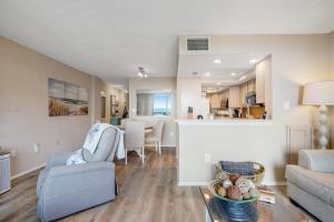 a living room with a couch and a table at Sea Colony --- 208 Brandywine House in Bethany Beach +40 photos