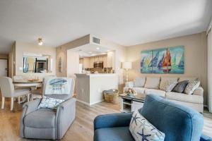 a living room with a couch and a table at Sea Colony --- 208 Brandywine House in Bethany Beach